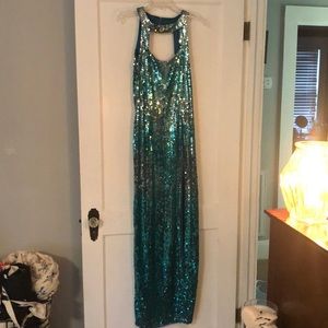 Sequin long dress with slip up the side.